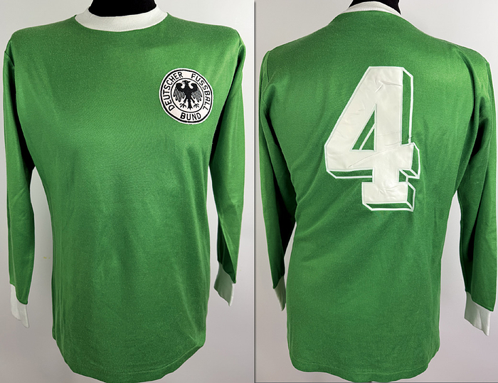 match worn football shirt germany 1975 - Original match-worn German national team shirt, number 4, worn by Wolfgang Schwarzenbeck, from the international match against Turkey on December 20, 1975, in Istanbul. The jersey comes from the collection of a former DFB (German Football Association) team official. Status: ABA (Austrian Association of Football Managers) long-sleeved shirt; size M; DFB crest embroidered; rubberized player number; polyester-cotton blend; made in West Germany. Condition: B. Condition: B