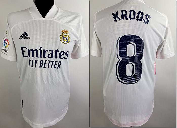  - Original match-worn Real Madrid player shirt with the number 8. Worn in a La Liga match by Toni Kroos in the 2020/2021 season. Status: ABC. Condition: Short-sleeved shirt; size 4; club crest applied; Adidas logo applied; chest sponsor, player name and number applied; La Liga patch applied; 100% polyester; Made in Cambodia. Condition: A
